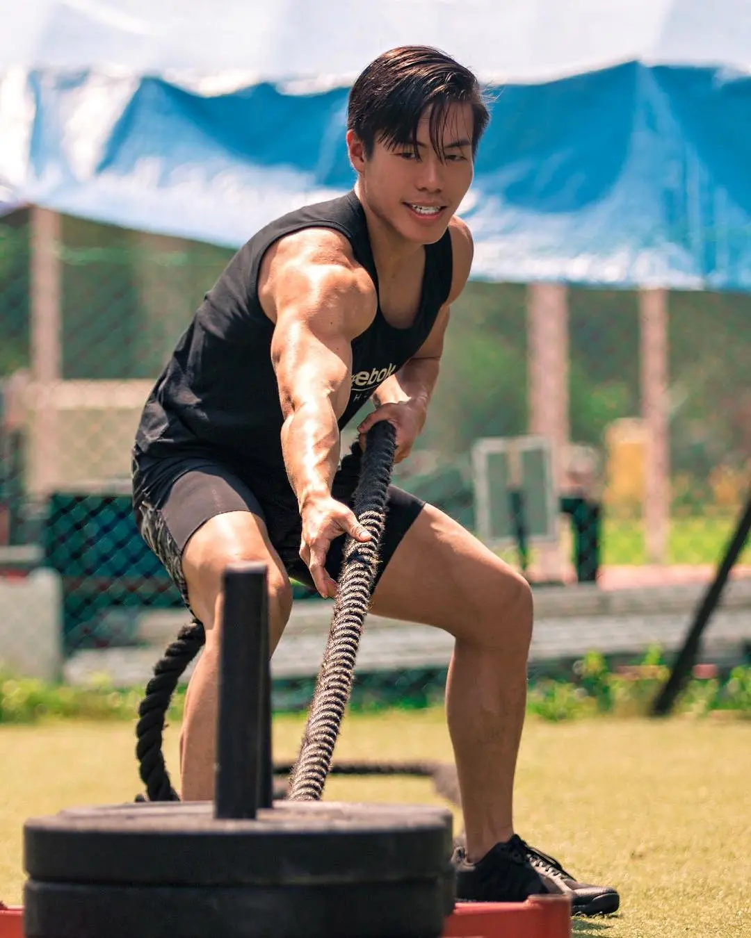 Luke Lee training with battle ropes as a Reebok ambassador